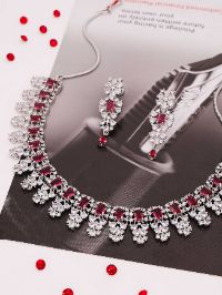 Sleek silver necklace embellished with dazzling white & red AD