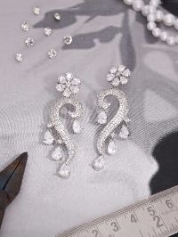 Glamorous Silver Earrings showcasing Stunning white AD gemstones