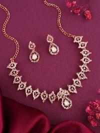 Contemporary rose gold necklace set featuring AD stones