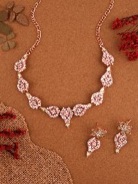 Modern rose gold necklace set enhanced by brilliant White AD