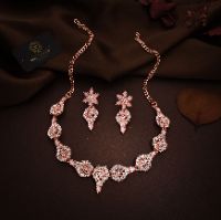 Luxurious rose gold jewelry collection showcasing AD jewels