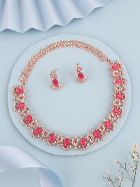 Contemporary rose gold accessory set with white AD