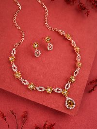 Chic rose gold necklace and earring set adorned with white AD gems