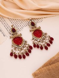 Elegant gold earrings with kundan and beads accents