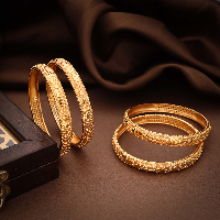 Radiant Fusion: Brass Bangles Adorned with Gold Accents