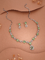 Silver Plated Necklace Set With Studded American Diamonds And Light Green Stones.