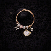 Elegant Timepiece Featuring Diverse, Intricately Designed Charms for a Stylish and Personalized Look