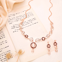 Artisan-Crafted Rose Gold AD Diamond Necklace Set Featuring Elaborate Leaf Designs and Coordinating Earrings