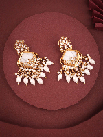 Intricately Designed Gold-Tone Earrings with White Kundan Embellishments, a Central White Stone, and Dangling Pearl Clusters Intricately Designed Gold-Tone Earrings with White Kundan Embellishments, a Central White Stone, and Dangling Pearl Clusters