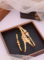 Contemporary Gold-Plated Kada Bangles with Crystal Swirl Design Contemporary Gold-Plated Kada Bangles with Crystal Swirl Design